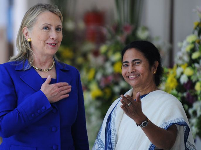 INDIA : US Secretary of State Hillary Clinton (L) talks with India's West Bengal state Chief Minister Mamata Banerjee at the Writers' Building, which houses the state secretariat, in Kolkata on May 7, 2012. US Secretary of State Hillary Clinton said May 7 she hoped the United States would elect a woman as president during her lifetime, but again rejected calls for her to make a new White House run. Clinton said that women still suffered from a "glass ceiling" in politics, complaining that media write of the "pastel hues" in women leaders' wardrobes even when they are talking about defence policy. AFP