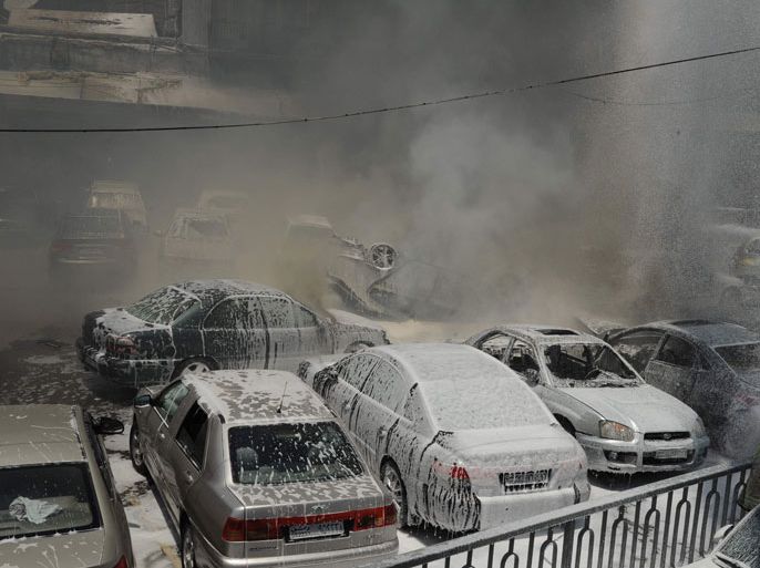 Smoke fills the air at the scene of two huge bomb explosions outside the Palace of Justice in Central Damascus on June 28, 2012. A police source told AFP on condition of anonymity that two magnetic bombs exploded in two judges' cars in the open-air car park, while a third was in the process of being defused. AFP PHOTO/STR