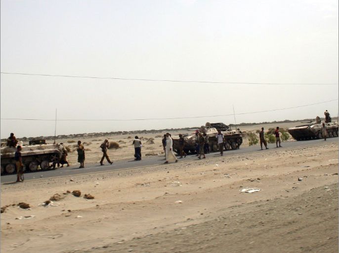 Yemeni army troops patrol the road between the provincial capital Zinjibar and the town of Jaar in the southern restive region of Abyan on June 22, 2012. Landmines planted in Yemen's southern province of Abyan by Al-Qaeda militants before they were driven out from the area have killed at least 35 people in the past 10 days, officials said. AFP PHOTO/STR