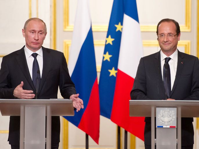 BL2451 - Paris, Paris, FRANCE : Russian President Vladimir Putin (L) speaks next to France's President Francois Hollande during a press conference at the presidential Elysee in Paris on June 1, 2012. Hollande said today that "no solution is possible" in Syria without "the departure of Bashar al-Assad" at a press conference with Russian President Vladimir Putin