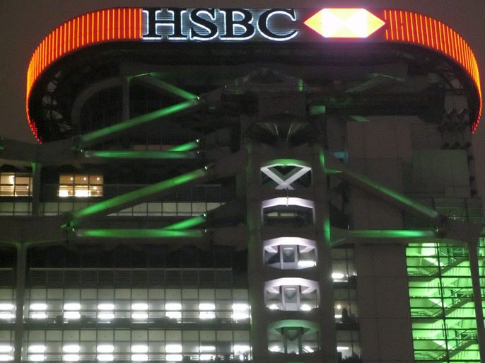 The multicoloured new lighting display on the headquarters of HSBC in Hong Kong makes the building glitter under a lowering night sky Tuesday 01 March 2005. HSBC announced profits of GBP9.6 billion (14 billion euros) a record for a UK company but still disappointing market expectations. Despite a 37 percent year on year increase in profits HSBC shares fell 25p to 868p on Monday dragging the FTSE lower. EPA/ADRIAN BRADSHAW