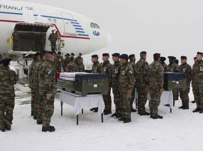 epa03073055 French soldiers carry the coffins containing the bodies of their comrades, during their repatriation to a French Republic plane at the runway of Kabul Airport, 22 January 2012. A gunman wearing a uniform of the Afghan army opened fire on French troops inside a base at Gwam base, in eastern Afghanistan. EPA/GHISLAIN MARIETTE / ECPAD / HANDOUT HANDOUT EDITORIAL USE ONLY