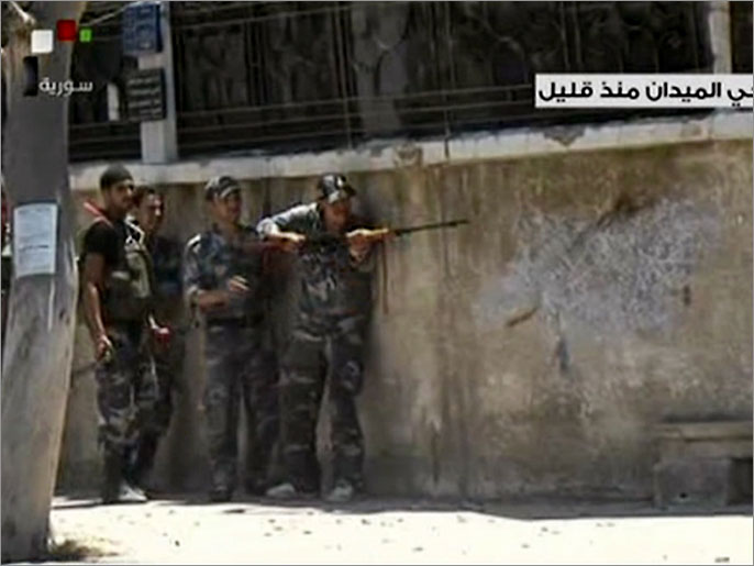  التلفزيون الرسمي بث جانبا من الاشتباكات في حي الميدان (الفرنسية)