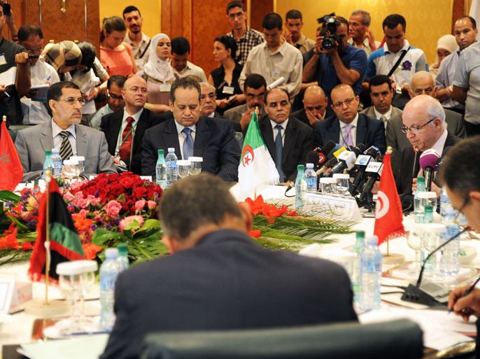 02 - Algiers, -, ALGERIA : Algerian Foreign Minister Mourad Medelci (R) speaks during a meeting of Foreign Ministers of the Arab Maghreb Union to discuss regional security, in Algiers on July 9, 2012. AFP PHOTO / FAROUK BATICHE