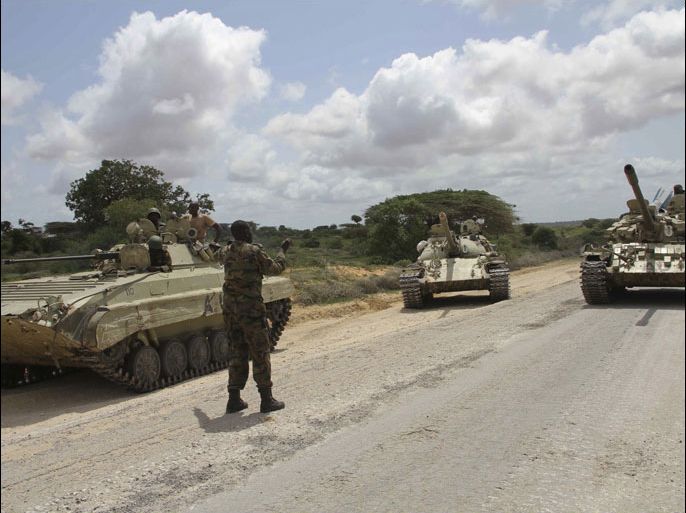 epa03282851 Tanks of the African Union forces advance near the Balad town during the operation, 30 km north of Mogadishu, Somalia, 26 June 2012. The Somali Natioanl Security forces backed by African Union troops have secured the strategic town of Balad on 26 June, according to the African Union forces in Somalia. 'Securing Balad allows the local population in this important farming region to build their livelihoods free from extortion of money which al-Shabab used to fund their daily terror activities against the Somali people', the African Union said in a statement on 26 June. This is the latest success of joint forces' operation against al-Shabab militants group. EPA/ELYAS AHMED