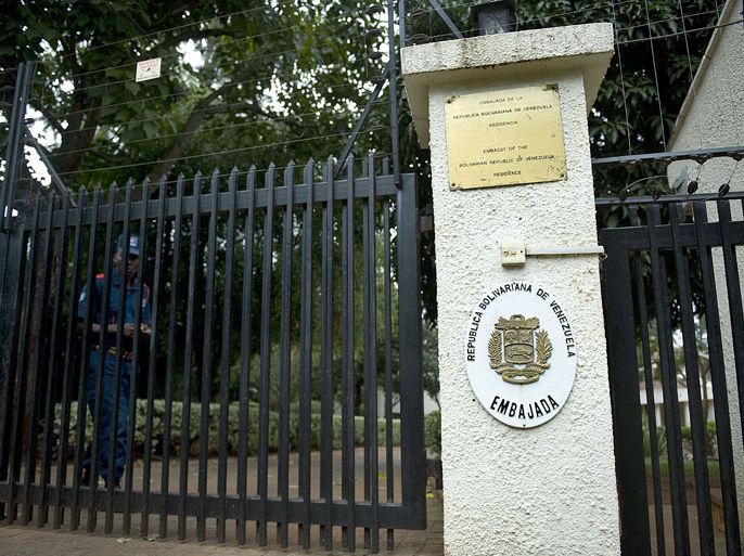 A security guard from a private company walks on July 27, 2012 near the gate the of the Venezuelan embassy residence in a Nairobi suburb. Venezuela's acting ambassador, Olga Fonseca, was found strangled at her Nairobi home, Kenyan police said. AFP PHOTO/Tony KARUMBA