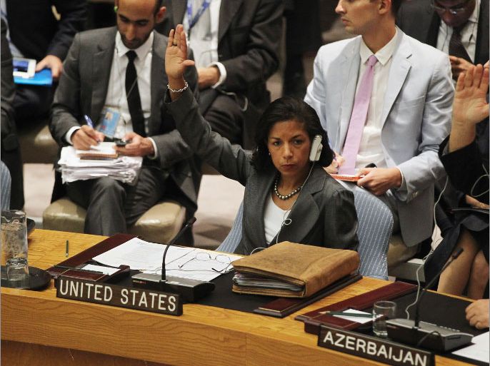 NEW YORK, NY - JULY 19: United States Ambassador to the United Nations Susan Rice (C) votes in favor of a new U.N. Security Council resolution on Syria at U.N. headquarters on July 19, 2012 in New York City. The resolution aimed at ending the violence with non-military sanctions in Syria failed to gather enough votes to pass as Russia and China veto the resolution. Mario Tama/Getty Images/AFP== FOR NEWSPAPERS, INTERNET, TELCOS & TELEVISION USE ONLY ==