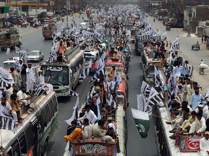 PAKISTAN : Activists and supporters of The Defence of Pakistan coalition sit on vehicles in Lahore on July 8, 2012, as they take part in a protest rally to Islamabad. Pakistan's Islamists who oppose their country's anti-terror alliance with Washington