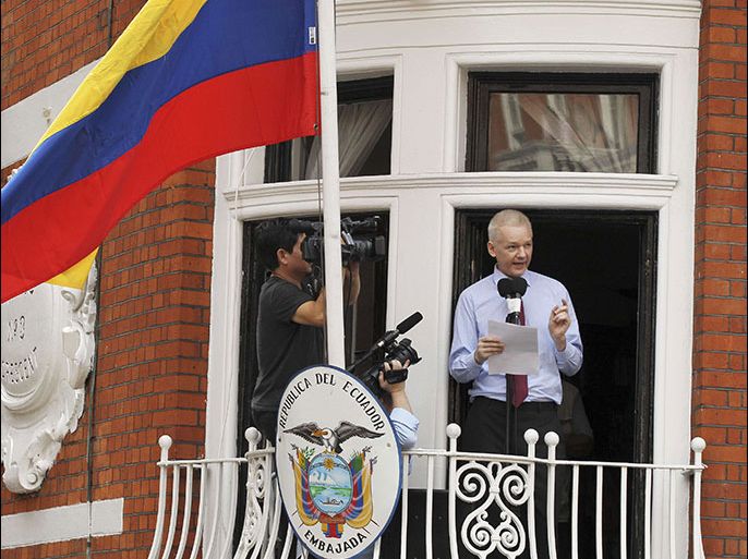 WikiLeaks founder Julian Assange speaks to the media outside the Ecuador embassy in west London August 19, 2012. Assange used the balcony of Ecuador's London embassy on Sunday to berate the United States for threatening freedom of expression and called on U.S. President Barack Obama to end what he called a witch-hunt against WikiLeaks. REUTERS/Olivia Harris (BRITAIN - Tags: POLITICS CRIME LAW MEDIA)