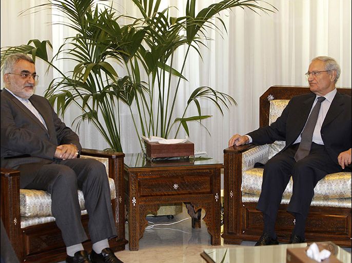r : Syrian Vice President Farouq al-Sharaa (R) meets Aleddin Borougerdi, head of the Iranian parliamentary committee for national security and foreign policy, in Damascus August 26, 2012. Sharaa met an Iranian delegation on Sunday, Syria's state news agency said, marking the official's first appearance in weeks and ending rumours by opposition activists that he had defected from President Bashar al-Assad's government. REUTERS/Khaled al-Hariri (SYRIACIVIL UNREST - Tags: POLITICS)