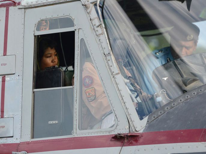 Rimsha Masih, a Christian girl accused of blasphemy sits in helicopter after her release from jail in Rawalpindi on September 8, 2012. Masih was arrested on August 16 for allegedly burning pages containing verses from the Koran but she was released from a prison in Rawalpindi after a court accepted her bail application.
