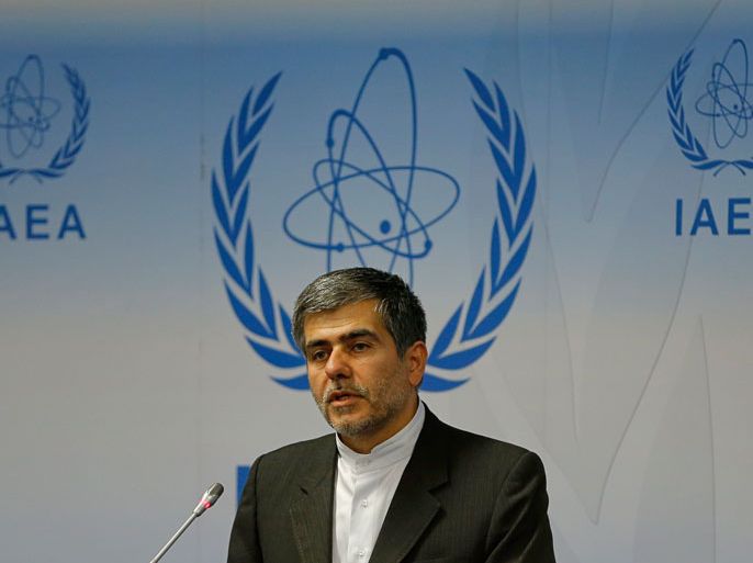 Iran's head of Atomic Energy Organisation Fereydoon Abbasi Davani (C), answers questions during a press conference during the 56th International Atomic Energy Agency (IAEA) General Conference at the IAEA headquarters in Vienna on September 17, 2012. Explosive blasts cut power lines to Iran's underground nuclear facility at Fordo last month, the head of Iran's atomic agency said at a meeting of UN atomic watchdog member states Monday. AFP PHOTO / ALEXANDER KLEIN