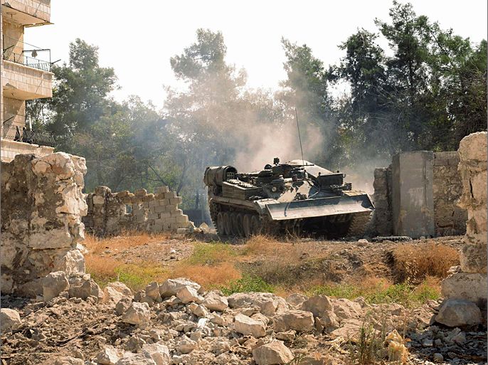 A Syrian army tank is seen in the Suleiman al-Halabi neighborhood, after clashes between Free Syrian Army fighters and regime forces in Aleppo city October 5, 2012. REUTERS/George Ourfalian (SYRIA - Tags: CONFLICT CIVIL UNREST MILITARY POLITICS)