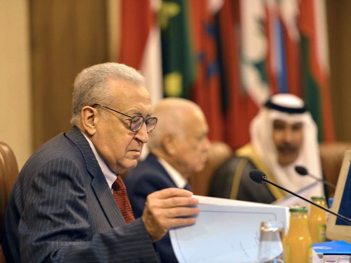Cairo, -, EGYPT : From left to right:-International peace envoy for Syria Lakhdar Brahimi looks at his notes as he sits along side Arab League General Secretary Nabil al-Arabi and Qatari Prime Minister Sheikh Hamad bin Jassem al-Thani, as they attend a meeting on Syria at the Arab League in Cairo, on November 12, 2012. Syria's newly united opposition launched a push for diplomatic recognition at a meeting of Arab foreign ministers in Cairo, buoyed by the hard-won unity deal among the disparate factions. AFP PHOTO