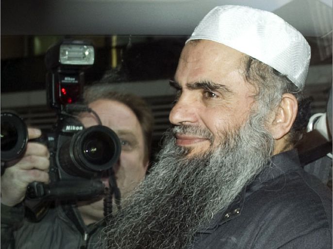 (FILES) - A picture dated April 17, 2012 shows radical Islamist cleric Abu Qatada sitting in a car as he is driven away from a Special Immigration Appeals Hearing at the High Court in London to jail after being re-arrested. British judges upheld on November 12, 2012 an appeal by terror suspect Abu Qatada against his extradition to Jordan, a decision immediately condemned by the government in London. AFP PHOTO/MIGUEL MEDINA