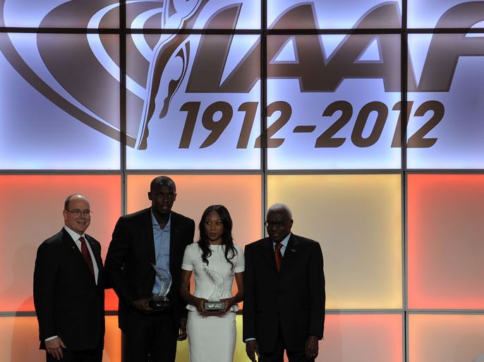 (FromL) Prince Albert of Monaco, Jamaican athlete Usain Bolt, US sprinter Allyson Felix and IAAF (International Association of Athletics Federations) President Lamine Diack pose for photographers during the IAAF´s Athlete of the Year Award marking its centenary on November 24, 2012 in Barcelona. AFP PHOTO/ LLUIS GENE