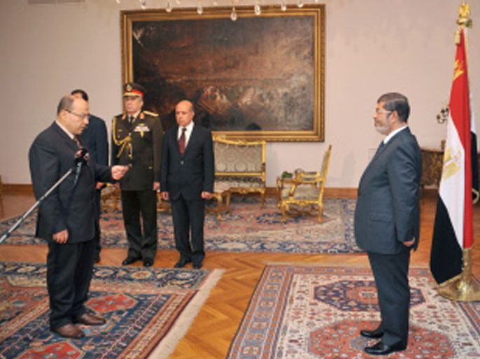 A handout picture released by the Egyptian presidency on November 22, 2012, shows newly appointed Prosecutor General Talaat Ibrahim Abdallah (L) meeting with Egyptian President Mohamed Morsi (R) at the presidential palace in Cairo. Morsi assumed sweeping powers prompting prominent opposition figure Mohamed ElBaradei to accuse him of usurping authority and becoming a "new pharoah". AFP PHOTO/HO/EGYPTIAN PRESIDENCY == RESTRICTED TO EDITORIAL USE - MANDATORY CREDIT "AFP PHOTO / HO / EGYPTIAN PRESIDENCY" - NO MARKETING NO ADVERTISING CAMPAIGNS - DISTRIBUTED AS A SERVICE TO CLIENTS ==