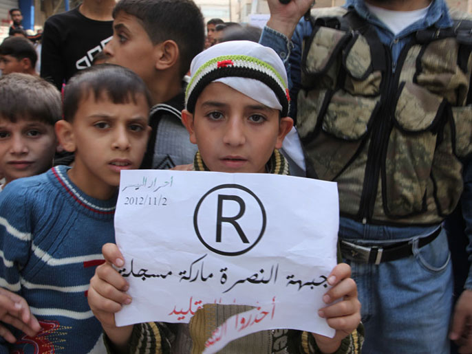 شعارات في مظاهرة بسوريا تؤيد جبهة النصرة (الجزيرة-أرشيف)