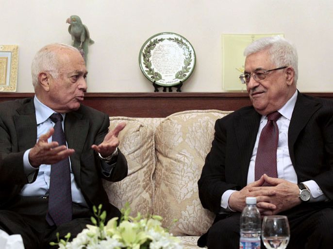 Arab League secretary general Nabil al-Arabi speaks with Palestinian president Mahmud Abbas (R) during a meeting at the Palestinian ambassador's residence in the Jordanian capital Amman on November 5, 2012. AFP PHOTO/KHALIL MAZRAAWI