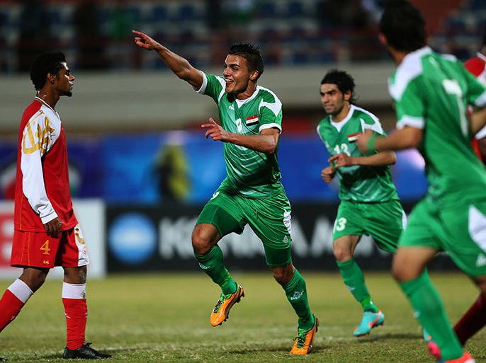 Kuwait City, -, KUWAIT : Ahmed Gheni (C) of Iraq celebrates after scoring a goal during their semi-final football match against Oman in the 7th West Asia Football Federation (WAFF) championship in Kuwait City on December 18, 2012. AFP PHOTO/MARWAN NAAMANI