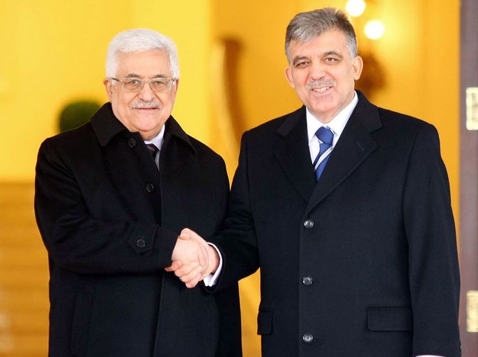 afp : Palestinian president Mahmud Abbas (L) shakes hands with his Turkish counterpart Abdullah Gul during a welcoming ceremony at Cankaya Palace in Ankara on December 11, 2012. Abbas on December 10 vowed to respond if Israel moves ahead with plans to build 3,000 settler homes in east Jerusalem after the Palestinians won non-member observer status at the United Nations. AFP PHOTO/ADEM ALTAN