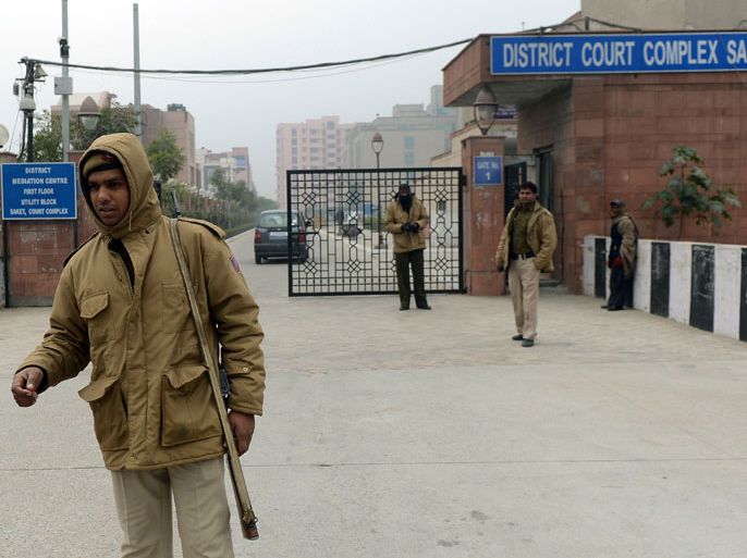 -, INDIA : Indian police personnel stand guard outside the district court Saket in New Delhi on January 3, 2013. A gang of men accused of repeatedly raping a 23-year-old student on a moving bus in New Delhi in a deadly crime that repulsed the nation are to appear in court for the first time. Police are to formally charge five suspects with rape, kidnapping and murder after the woman died at the weekend from the horrific injuries inflicted on her during an ordeal that has galvanised disgust over rising sex crimes in India. AFP PHOTO/ Prakash SINGH