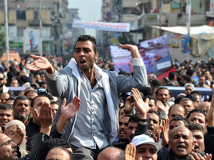 An Egyptian man shouts during a rally in the streets of the canal city of Port Said, on January 29, 2013. Egypt's military chief warned that the political crisis sweeping the country could lead to the collapse of the state, as thousands defied curfews and the death toll from days of rioting rose to 52. AFP PHOTO / STR