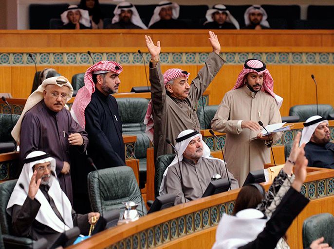 Kuwaiti MPs vote on a bill during a parliament session at the national assembly in Kuwait City on January 23, 2013. Kuwait's national carrier plans to buy up to 21 new aircraft over the next two years after parliament passed a key bill transforming it into a commercial company, its chairman said. AFP PHOTO/YASSER AL-ZAYYAT