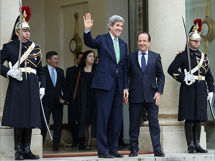 epa03602332 US Secretary of State John Kerry (L) waves as he is escorted by French President Francois Hollande (R) after their meeting at the Elysee Palace in Paris, France, 27 February 2013. Kerry is on a tour of major European capitals this week which is his first trip abroad since taking office this month. EPA/IAN LANGSDON