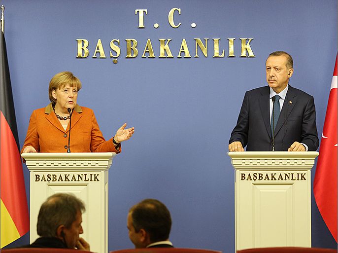 German Chancellor Angela Merkel and Turkey's Prime Minister Tayyip Erdogan (R) attend a joint news conference in Ankara February 25, 2013. REUTERS/Altan Burgucu (TURKEY - Tags: POLITICS)