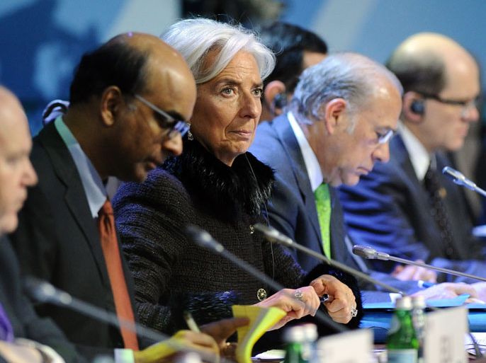 : International Monetary Fund (IMF) Managing Director Christine Lagarde (C) attends a meeting of G20 states finance ministers and central bank governors' deputies in Moscow, on February 16, 2013. The ministers and central bank governors' deputies gathered today in Moscow for their first meeting in the Russian capital aimed at reassuring markets that the world's economic powers would not slug it out in "currency wars" to boost national growth. AFP HOTO/YURI KADOBNOV