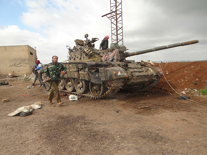 مجموعة من عناصر الجيش الحر في درعا (رويترز)