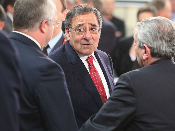 US Secretary of Defense Leon Panetta (C) talks with Italy Defense Minister Giampaolo Di Paola (R) before a meeting of the North Atlantic Treaty Organization (NATO) on February 21, 2013 at the organization's headquarters in Brussel. Panetta is attending NATO Defense Ministers Meetings and holding bilateral meetings with fellow defense officials. AFP PHOTO / POOL / CHIP SOMODEVILLA
