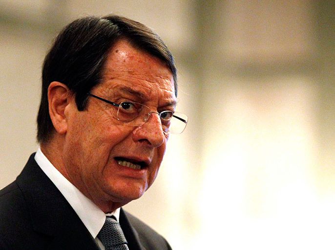 Cyprus' President Nicos Anastasiades addresses a conference of civil servants in Nicosia March 29, 2013. Cyprus has no intention of leaving the European single currency, the island's president said on Friday, assuring Cypriots the situation was "contained" in the wake of a tough bailout deal with the European Union. Anastasiades spoke a day after banks reopened their doors following an almost two-week shutdown to prevent a run on deposits by panicked Cypriots and wealthy foreign depositors as the east Mediterranean island flirted with bankruptcy. REUTERS/Bogdan Cristel (CYPRUS - Tags: BUSINESS POLITICS HEADSHOT)