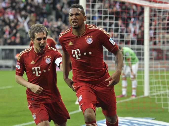 Bayern Munich's defender Philipp Lahm (L) and Bayern Munich's defender Jerome Boateng celebrate scoring during the German first division Bundesliga football match FC Bayern Munich vs Fortuna Duesseldorf, in Munich southern Germany on March 9, 2013. AFP PHOTO / GUENTER SCHIFFMANN