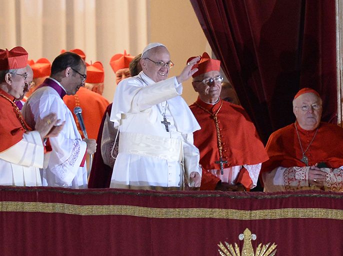 Argentina's cardinal Jorge Bergoglio, elected Pope Francis I (C) appears with cardinals at the window of St Peter's Basilica after being elected the 266th pope of the Roman Catholic Church on March 13, 2013 at the Vatican. AFP PHOTO / FILIPPO MONTEFORTE