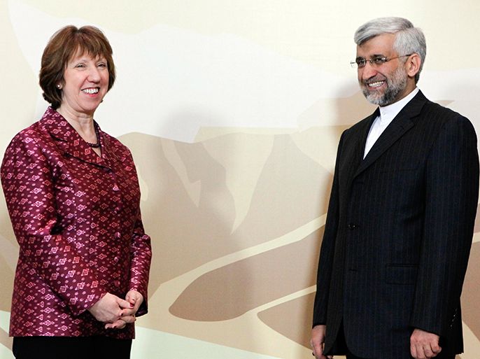 Iran's Chief negotiator Saeed Jalili (R) and European Union Foreign Policy chief Catherine Ashton stand for a photograph before talks in Almaty April 5, 2013. World powers will urge Iran on Friday to accept their offer to ease some economic sanctions if it stops its most sensitive nuclear work, in talks aimed at easing tensions that threaten to boil over into war. REUTERS/Shamil Zhumatov (KAZAKHSTAN - Tags: POLITICS)