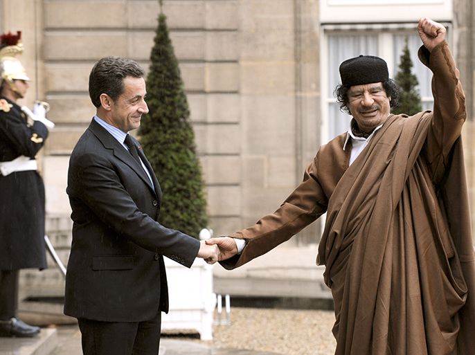 (FILES) - A picture taken on December 10, 2007 shows French president Nicolas Sarkozy (L) welcoming Libyan leader Moamer Kadhafi at the French Elysee Palace in Paris. French prosecutors on April 19, 2013 opened a probe into allegations the Libyan regime contributed to the 2007 campaign of Nicolas Sarkozy, who went on to become president, a judicial source said. The probe -- the latest in a string of allegations relating to Sarkozy's years in office and electoral campaigns -- is looking into charges of "active and passive corruption", "influence peddling" and others, the source added. AFP PHOTO ERIC FEFERBERG