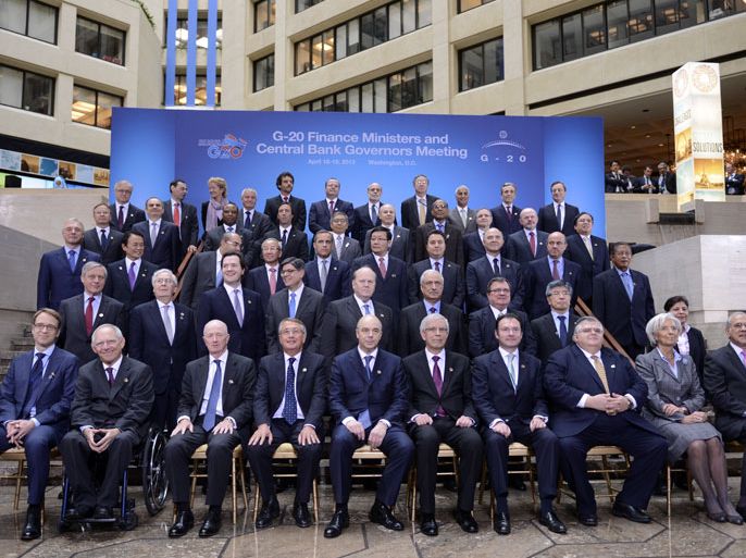 epa03669113 G-20 finance ministers and central bankers sit for a goup photo at the 2013 IMF and World Bank Spring Meetings in Washington, DC, USA, 19 April 2013. The 2013 IMF WB Spring meetings run through Sunday 21 April. EPA/SHAWN THEW