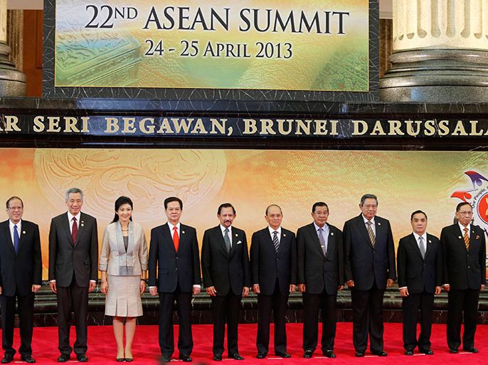 Leaders of the Association of Southeast Asian Nations (ASEAN) pose for a group photo during the 22nd ASEAN Summit in Bandar Seri Begawan April 25, 2013. The leaders are (L-R) Philippine President Benigno Aquino, Singapore's Prime Minister Lee Hsien Loong, Thailand's Prime Minister Yingluck Shinawatra, Vietnam's Prime Minister Nguyen Tan Dung, Brunei's Sultan Hassanal Bolkiah, Myanmar's President Thein Sein, Cambodia's Prime Minister Hun Sen, Indonesia's President Susilo Bambang Yudhoyono, Laos Prime Minister Thongsing Thammavong and Malaysia's Senate President Abu Zahar Ujang. REUTERS/Bazuki Muhammad (BRUNEI - Tags: POLITICS ROYALS)