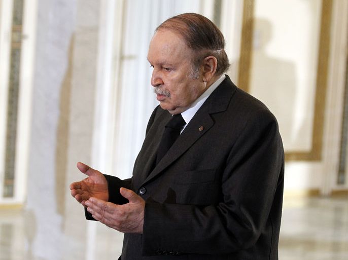 epa03180064 Algerian President Abdelaziz Bouteflika pays respects at the coffin of Algeria's first post-independence president, Ahmed Ben Bella, in the People's Palace in Algiers, Algeria, 12 April 2012. Ben Bella died on 11 April 2012 at the age of 95. He was a charismatic revolutionary who fought alongside the French during World War II before becoming a hero of his own country's liberation struggle. EPA/MOHAMED MESSARA