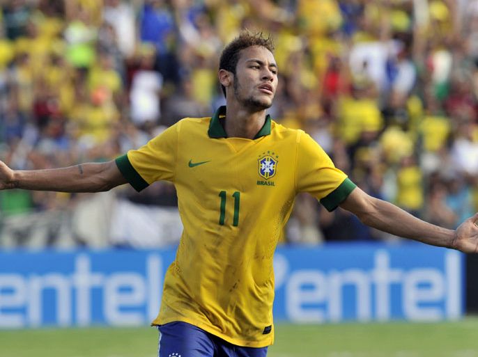 Santa Cruz, -, BOLIVIA : (FILES) A file picture taken on April 6, 2013 shows Brazilian national football team player Neymar celebrating after scoring against Bolivia during their friendly football match in Santa Cruz, Bolivia. Brazilian football club Santos FC announced on May 24 that it would start negotiations to transfer Neymar to either Barcelona or Real Madrid of Spain. AFP PHOTO/Aizar Raldes