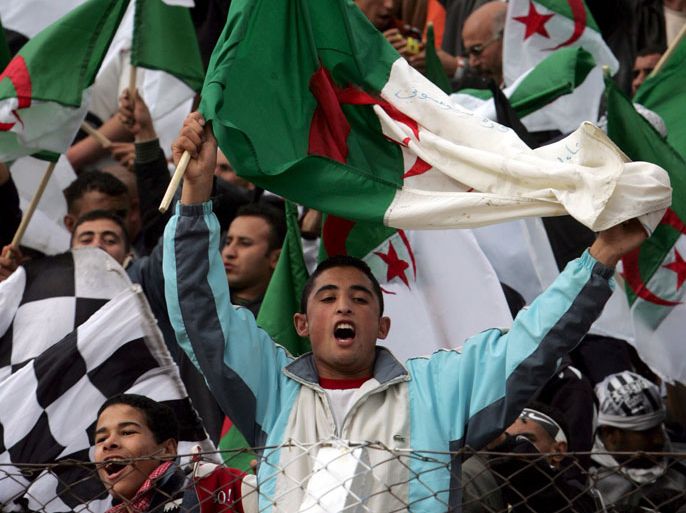 epa00999481 Supporters of Algerian team Entente Setif cheer prior to the Arab Champions League final soccer match between Algeria's Entente Setif and Jordan's Al Faycali 03 May 2007 in Setif, 300 km east of Algiers. EPA/MOHAMED MESSARA