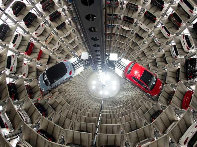 epa03704792 (FILE) A file photo dated 14 March 2013 shows a New Beetle Convertible (L) and a Golf VII being picked by an automatic elevator to be transported out of the glass silo, which is used as storage for new VW cars in Wolfsburg, Germany. European car sales posted their first gain in 20 months, rising 1.7 per cent in April compared with the same month last year, the European Automobile Manufacturers' Association (ACEA) said 17 May 2013. A total of 1.038 million new cars were registered in the European Union in April, the ACEA said. Registrations had slumped to an historic low of 1.021 million in April last year.