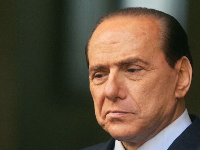 ROM077 - Rome, -, ITALY : (FILES) This picture taken on January 25, 2006 shows Silvio Berlusconi then Italian Prime Minister Silvio Berlusconi before a meeting at the Palazzo Chigi in Rome. An Italian court on June 24, 2013 sentenced Silvio Berlusconi to seven years in jail and also banned the former prime minister from holding public office for life in a trial where he was accused of paying for sex with an underage prostitute and abuse of office. AFP PHOTO / GIULIO NAPOLITANO