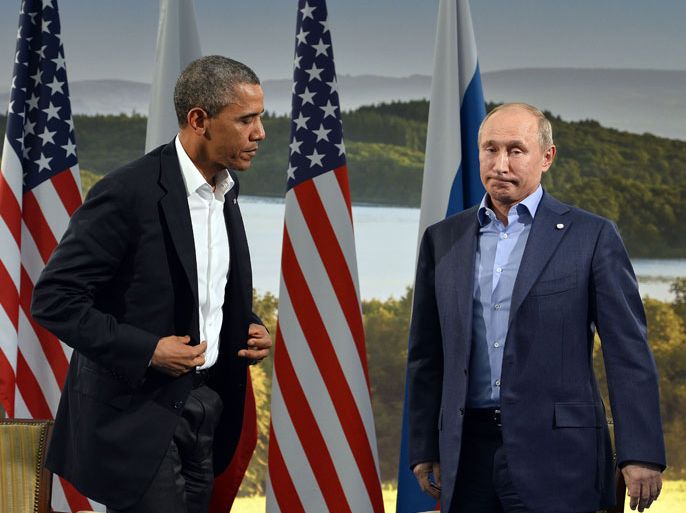 J090 - Enniskillen, Fermanagh, UNITED KINGDOM : US President Barack Obama (L) holds a bilateral meeting with Russian President Vladimir Putin during the G8 summit at the Lough Erne resort near Enniskillen in Northern Ireland, on June 17, 2013. The conflict in Syria was set to dominate the G8 summit starting in Northern Ireland on Monday, with Western leaders upping pressure on Russia to back away from its support for President Bashar al-Assad. AFP PHOTO / JEWEL SAMAD