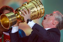 Bayern Munich's head coach Jupp Heynckes celebrates with the trophy after they won the final football match of the German Cup (DFB - Pokal) FC Bayern Munich vs VfB Stuttgart on June 1, 2013 in Berlin. AFP PHOTO / ROBERT MICHAELcelebrate after the final football match of the German Cup (DFB - Pokal) FC Bayern Munich vs VfB Stuttgart on June 1, 2013 in Berlin. Champions League winners Bayern Munich became the first Bundesliga champion to win the treble after their hard-earned 3-2 win over plucky VfB Stuttgart in Saturday's German Cup final. AFP PHOTO / ROBERT MICHAEL