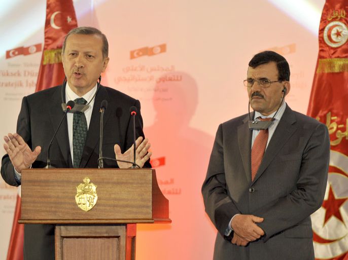 FB629 - Tunis, -, TUNISIA : Turkish Prime Minister Recep Tayyip Erdogan (L) speaks during a joint press conference with his Tunisian counterpart Ali Laarayedh (R) in Tunis on June 6, 2013. Erdogan said that members of a "terrorist organisation" were taking part in deadly anti-government protests sweeping Turkey and refused to cancel a controversial Istanbul development plan that sparked them. AFP PHOTO / FETHI BELAID