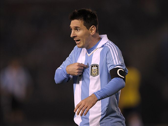 Argentine football star Lionel Messi gestures during their FIFA World Cup Brazil 2014 qualifying match against Colombia at the Monumental stadium in Buenos Aires on June 7, 2013. AFP PHOTO / Alejandro PAGNI
