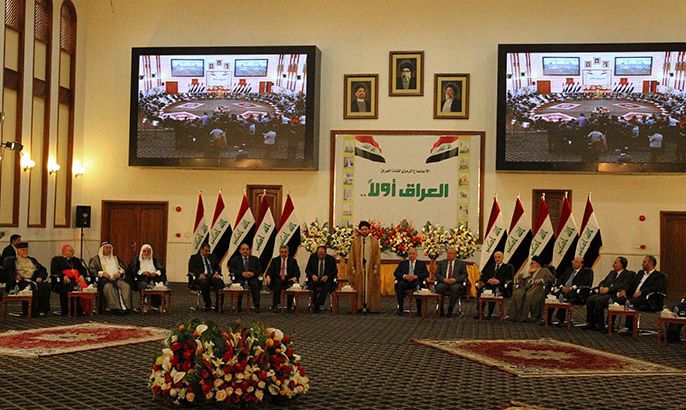 Iraqi Shiite Muslim leader and head of the Supreme Islamic Council, Ammar al-Hakim (C), speaks during a meeting of top Iraqi political and religious leaders, which was called for from late 2011, in Baghdad on April 1, 2013. The aim of the long-discussed meeting is to resolve a wide range of disputes between the country's political blocs, some of which have persisted for several years. AFP PHOTO/SABAH ARAR